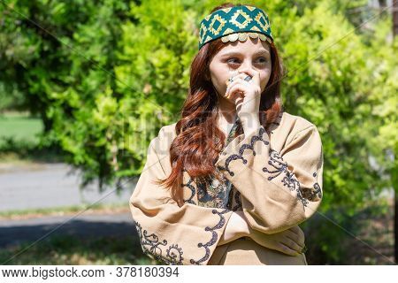 Armenian Young Woman In Traditional Clothes In The Forest