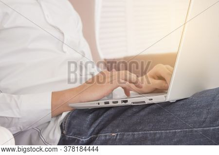 Handsome Businessman Working In His Office With The Wooden Background