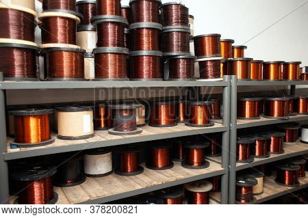 Many Coils Of Copper Wire In The Production Workshop, Winding Copper Cable On Spools