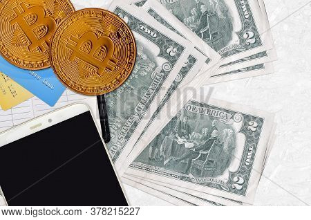 2 Us Dollars Bills And Golden Bitcoins With Smartphone And Credit Cards. Cryptocurrency Investment C