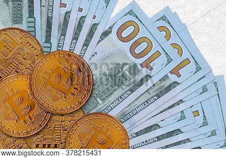 100 Us Dollars Bills And Golden Bitcoins. Cryptocurrency Investment Concept. Crypto Mining Or Tradin