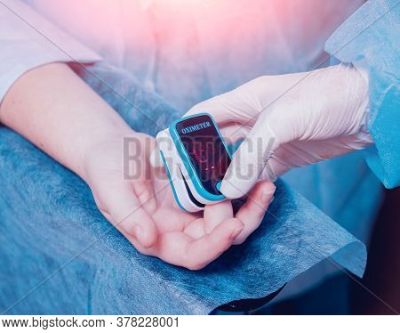 Pulse Oximeter On The Patients Hand. Surgery Equipment.