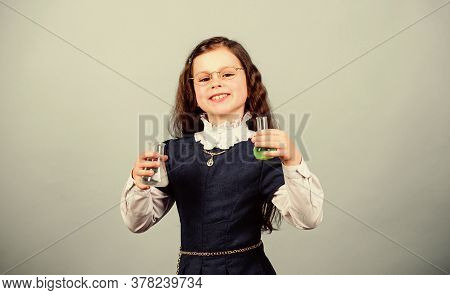 Small Girl Scientist With Testing Flask. Back To School. Education And Knowledge. Child Study Bilogy