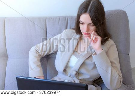 Freelancer Woman Working Typing On Laptop At Home Sitting On Couch, Freelance Distant Work On Quaran