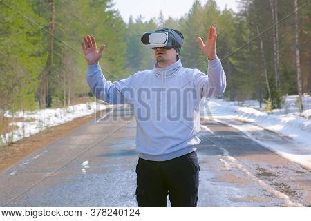 Portrait Man In Forest On Country Road In Vr Glasses Waving Hands And Turning Sides. Playing Games O