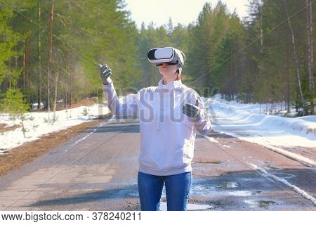 Portrait Woman In Forest On Country Road In Vr Glasses Waving Hands, Turning Sides. Playing Games Or