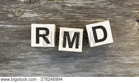 The Abbreviation Rmd Is Made From Wooden Building Blocks On A Gray Wooden Background.