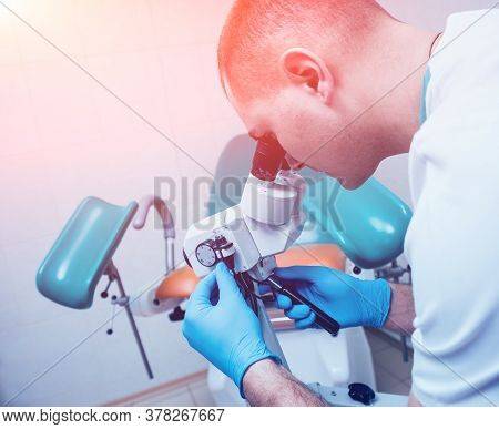 Gynecologist Working With Colposcope In Clinic. Medical