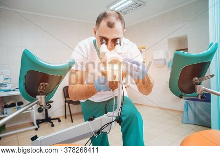 Gynecologist Working With Colposcope In Clinic. Medical