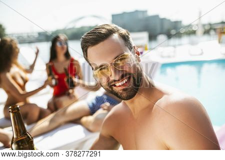 Young Handsome Man In Sungasses Smiling Nicely