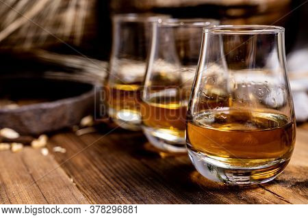 Speyside Scotch Whisky Tasting On Old Dark Wooden Vintage Table With Barley Grains Close Up