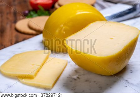 Dutch Baby Gouda Cheese In Yellow Wax Close Up