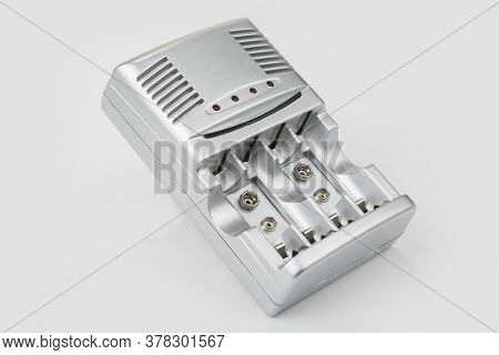 Battery Charger For 1,5v And 9v On A White