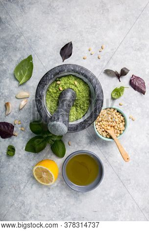 Making Pesto. Food Cooking And Culinary Concept -  Pine Nuts, Olive Oil  And Garlic For Basil Pesto 