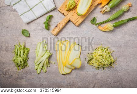 Variety Zucchini Vegetable Noodles - Green Zoodles Or Courgette Spaghetti On Plate Over Gray Backgro