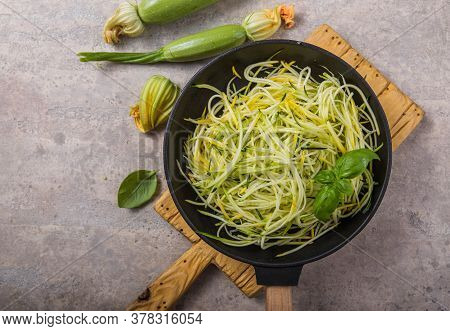 Zucchini Vegetable Noodles - Green Zoodles Or Courgette Spaghetti On Plate Over Gray Background. Cle