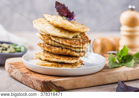 Vegetarian Zucchini Fritters Or Pancakes Stack Topped With Sour Cream And Cilantro. Vegetable Pancak