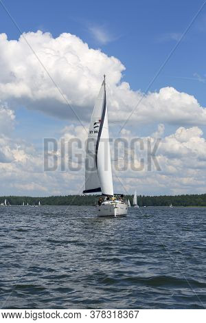 Masuria, Poland - June 24, 2020 : Lake In Polish Masuria, Sailing Yachts On A Sunny Day. Picturesque