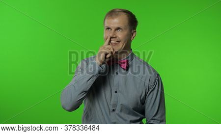 Funny Stupid Man Picking Nose With Silly Brainless Humorous Expression, Removing Boogers, Uncultured