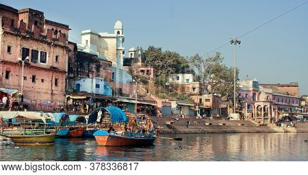Chitrakoot, India: Beautiful Indian City With Old Brick Houses, River Ghat And Colorful Boat On Wate
