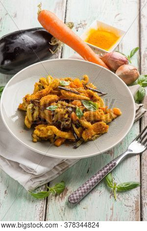 chicken stewed with eggpalnts carrots basil and turmeric spice
