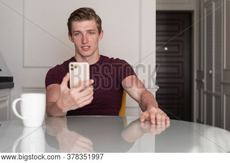 Young Man Sufring The Internet Via Phone
