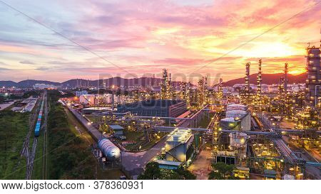 Aerial View Oil Refinery.industrial View At Oil Refinery Plant Form Industry Zone With Sunrise And C