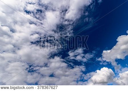 This Is A Picture Of Cumulus Clouds With Bright Blue Clouds. This Would Make A Good Back Groud Or Te