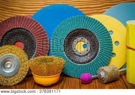Set Of Abrasive Tools And Sandpaper On Vintage Wooden Background