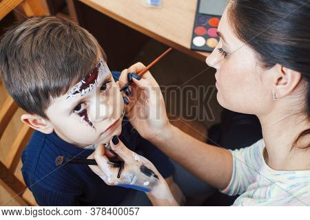 Little Cute Child Making Facepaint On Birthday Party, Zombie Apocalypse Facepainting, Halloween Prep
