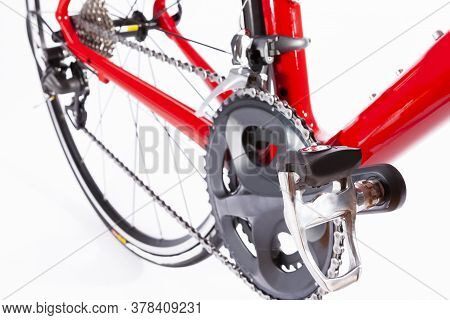 Cycling Ideas. Crankset And Rear Cassette With New Chain. Against White. Horizontal Shoor