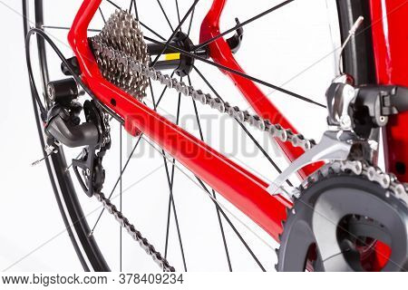 Cycling Ideas. Closeup Of Crankset And Rear Cassette With New Chain. Against White. Horizontal Image
