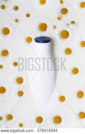 A White Bottle With A Place For The Logo Is Immersed In A Milk Bath And Surrounded By White Medicina