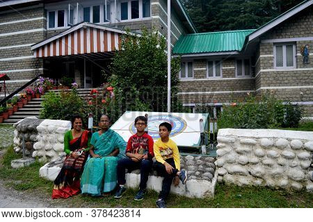Manali, Himachal Pradesh, India, 27 June 2017: Two Indian Women And Children Sitting In Front Of  Av