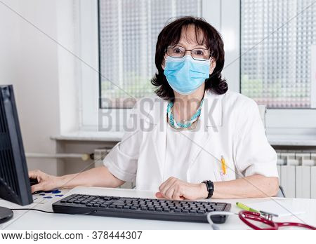Woman Doctor With Mask Portrait. Pulmologist For Covid-19. Doctor Pulmonologist With Mask In Covid-1