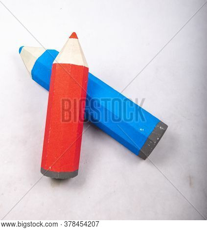Blue And Red Pencil Stands On A White Background