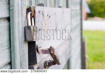 The Old Lock Was Used To Lock Old Wooden Doors. The Steel Silver Lock Reliably Locks Old Doors, Door