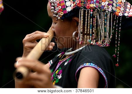 Hilltribe Playing Flute .