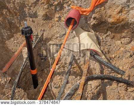 Construction Trench With Electrical Wires. Road Work For The Installation Of Fiber Optic Cables For 