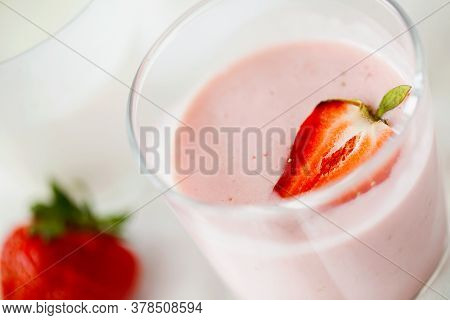 Organic Probiotic Milk Kefir Drink Or Yogurt With Strawberry In Glass On The White Grey Background C