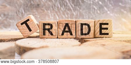 Wooden Blocks With The Word Trade. Business And Finance Concept.
