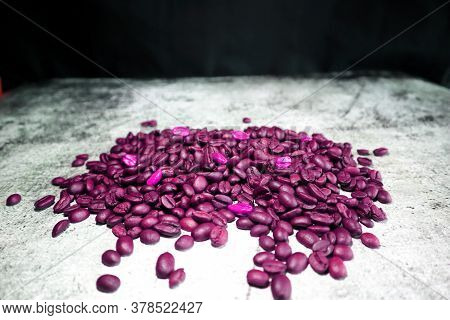Lot Of Coffee Beans On A Concrete Board