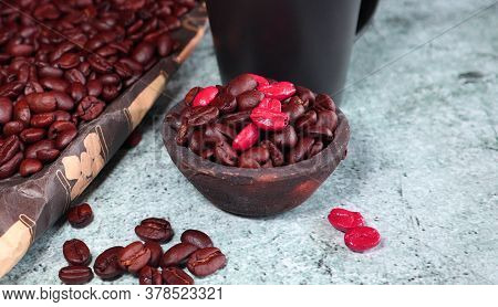 Clay Pot With Fresh Coffee Beans On A Concrete Board