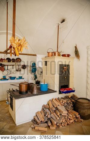 Ancient Copper Tableware Stands In The Kitchen On A Larger Antique Oven, Castle Interiors, Bitov Cas