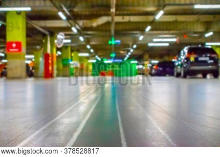 Parking Lot Cars Blurred. Car Lot Parking Space In Underground City Garage. Empty Road Asphalt Backg