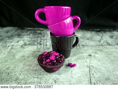 Ceramic Espresso Cups And A Small Clay Pot With Coffee Beans
