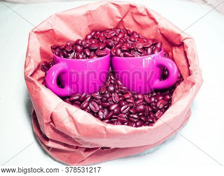 Ceramic Espresso Cups In A Paper Bag With Coffee Beans