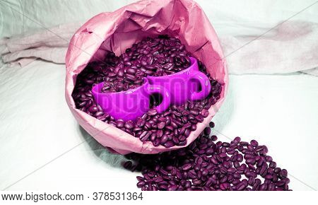 Ceramic Cups In A Paper Bag With Coffee Beans