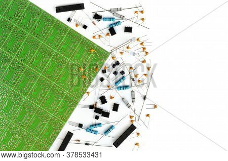 Various Electronic Components Arranged Near Green Electronic Circuit Board On White Background With 