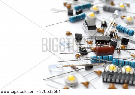 Various Electronic Components On White Background With Copy Space. Close-up, Selective Focus